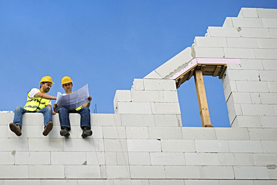 building contractors discussing construction plans